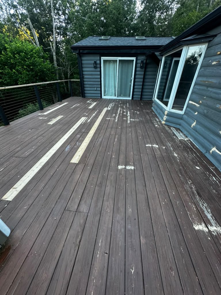 Before deck painting Massachusetts project showing a worn outdoor deck